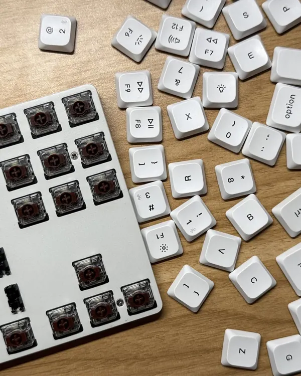 Pulled every keycap for a deep clean. Putting them back is the hard part.